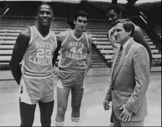 north carolina coach dean smith talks to michael jordan